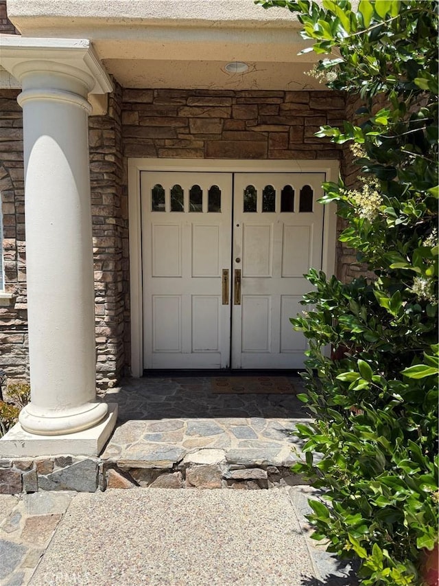 22241 Birchleaf, Mission Viejo, CA 92692 - property entrance with stone siding and a garage