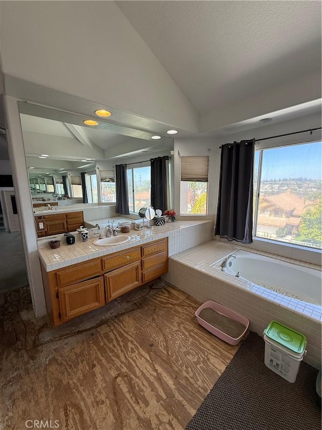 22241 Birchleaf, Mission Viejo, CA 92692 - bathroom featuring lofted ceiling, a bath, vanity, and recessed lighting