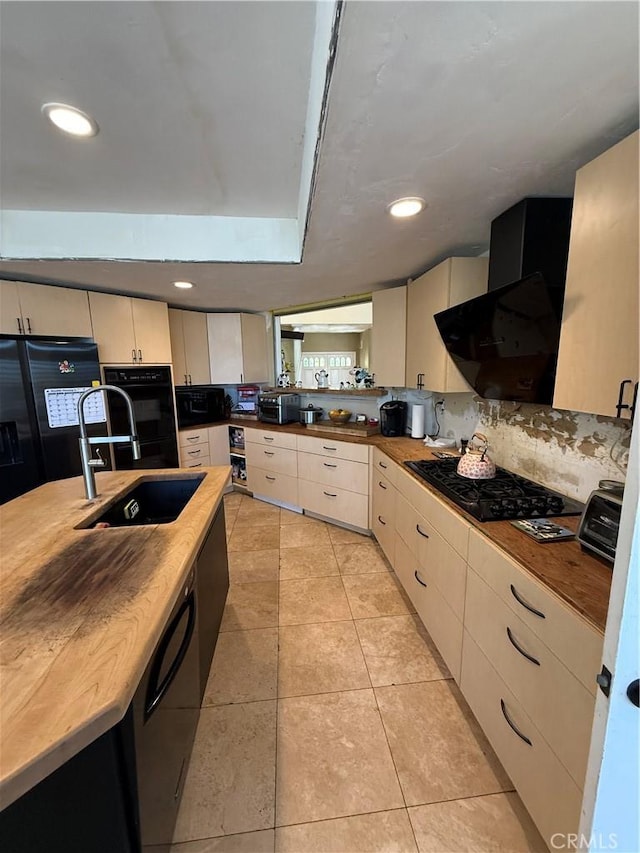 22241 Birchleaf, Mission Viejo, CA 92692 - kitchen with black appliances, wood counters, extractor fan, light tile patterned floors, and backsplash