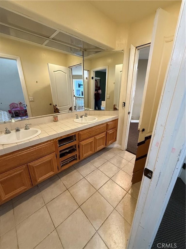 22241 Birchleaf, Mission Viejo, CA 92692 - ensuite bathroom featuring double vanity and tile patterned floors