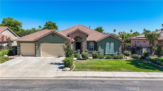17024 Granite Falls Way, Chowchilla, CA 93610 - view of front of home featuring a tiled roof, an attached garage, stucco siding, and concrete driveway