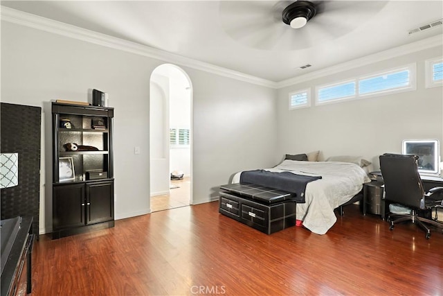 17024 Granite Falls Way, Chowchilla, CA 93610 - bedroom with arched walkways, wood finished floors, ornamental molding, and ceiling fan