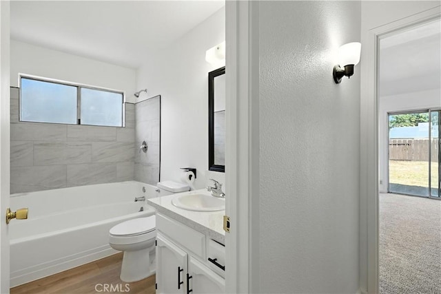 3537 Trinity Ct, Merced, CA 95340 - bathroom featuring vanity, shower / washtub combination, a textured wall, and wood finished floors