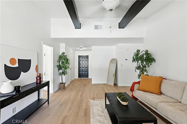 3537 Trinity Ct, Merced, CA 95340 - living area with a towering ceiling, light wood-style flooring, and beamed ceiling