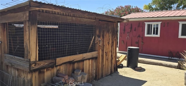 36916 95th St E, Littlerock, CA 93543 - view of home's exterior with an outdoor structure, a metal roof, and exterior structure
