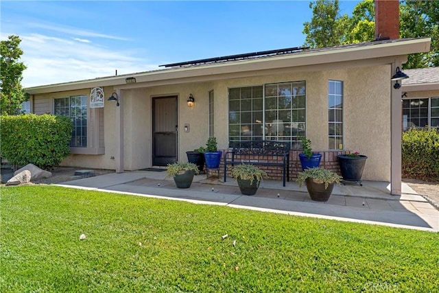 36916 95th St E, Littlerock, CA 93543 - view of front of home with a front lawn, stucco siding, a chimney, and a patio