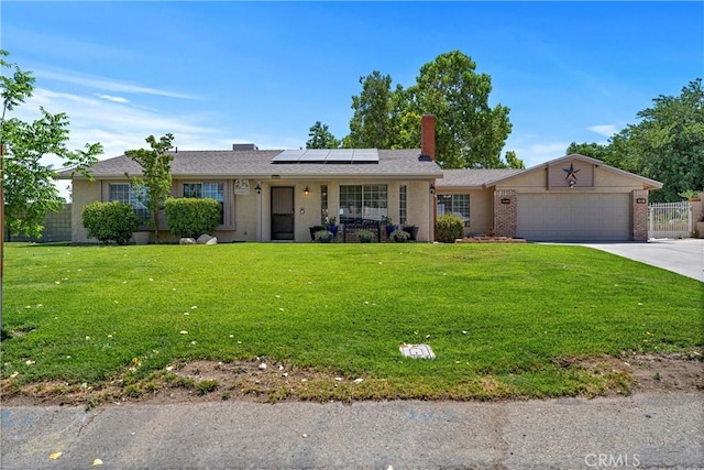 36916 95th St E, Littlerock, CA 93543 - single story home with solar panels, an attached garage, a front lawn, concrete driveway, and a chimney
