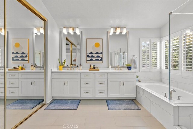 27318 Chesterfield Dr, Valencia, CA 91354 - bathroom featuring double vanity, a bath, and tile patterned flooring