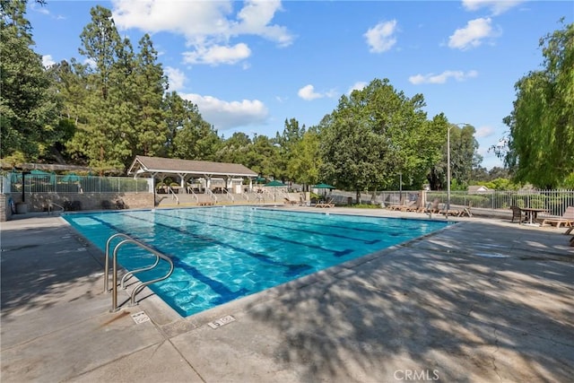 27318 Chesterfield Dr, Valencia, CA 91354 - community pool featuring view of scattered trees and a patio area
