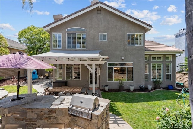 27318 Chesterfield Dr, Valencia, CA 91354 - rear view of house with area for grilling, a pergola, a patio area, stucco siding, and a yard