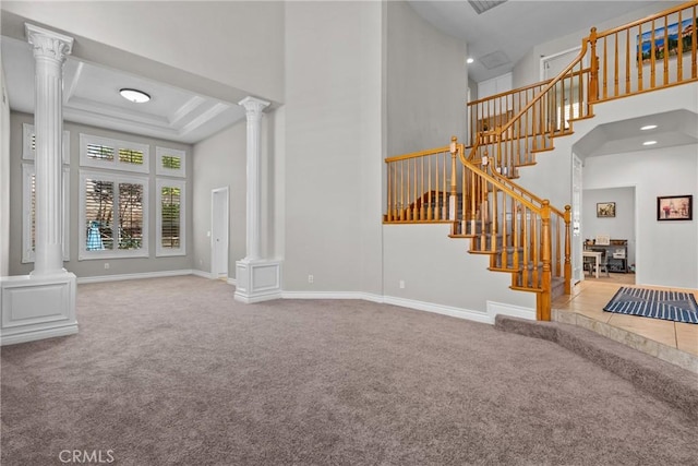 27318 Chesterfield Dr, Valencia, CA 91354 - unfurnished living room featuring decorative columns, carpet floors, and a towering ceiling