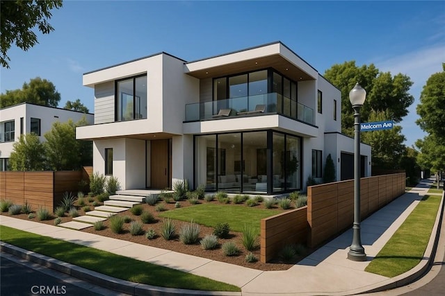 1536 Malcolm Ave, Los Angeles, CA 90024 - rear view of property with a balcony and stucco siding
