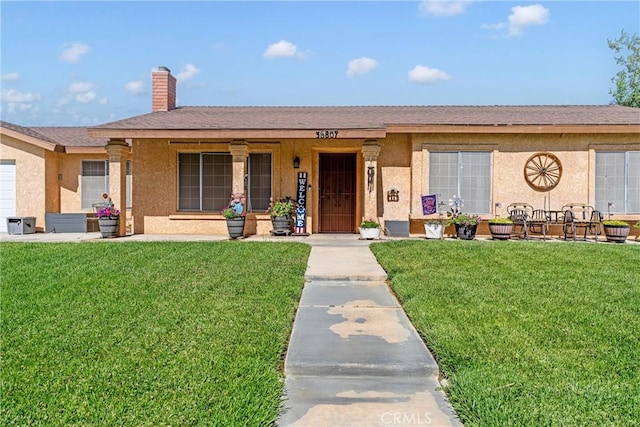 36807 95th St E, Littlerock, CA 93543 - single story home featuring a front yard, stucco siding, and a chimney