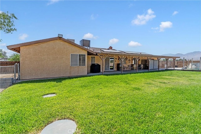 36807 95th St E, Littlerock, CA 93543 - rear view of property with solar panels, a patio, a fenced backyard, and stucco siding