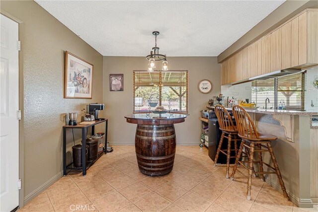 36807 95th St E, Littlerock, CA 93543 - bar area with light tile patterned floors, hanging light fixtures, a textured ceiling, and tasteful backsplash