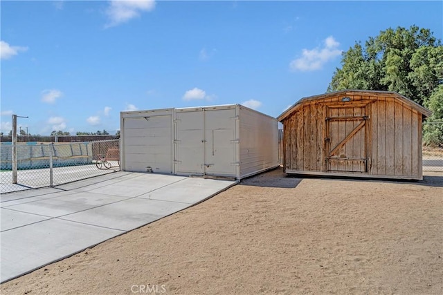 36807 95th St E, Littlerock, CA 93543 - view of home's community with a shed and a patio area