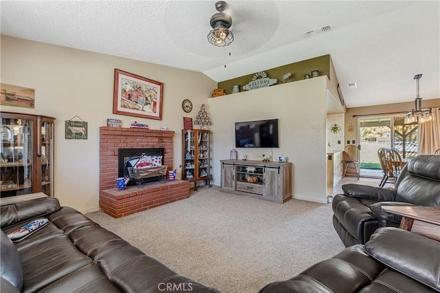 36807 95th St E, Littlerock, CA 93543 - carpeted living room with lofted ceiling, a ceiling fan, a brick fireplace, and a textured ceiling