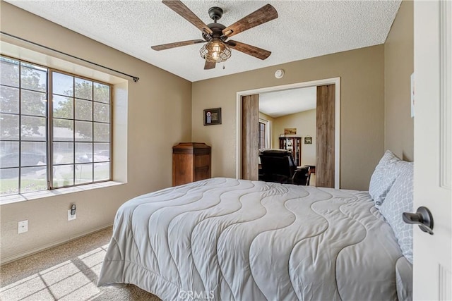 36807 95th St E, Littlerock, CA 93543 - carpeted bedroom featuring multiple windows, a textured ceiling, and ceiling fan