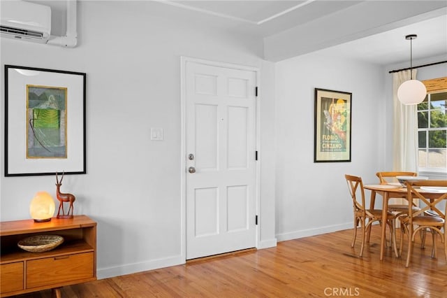 537 E Maple St Unit 3, Glendale, CA 91205 - dining area featuring a wall mounted air conditioner and light wood-style flooring