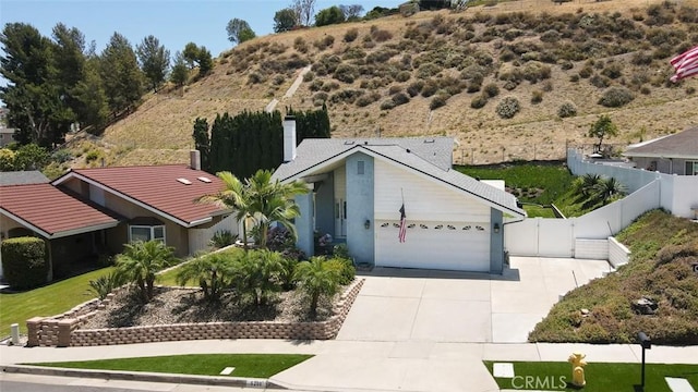 6200 Fairlynn Blvd, Yorba Linda, CA 92886 - single story home with driveway, a chimney, and an attached garage