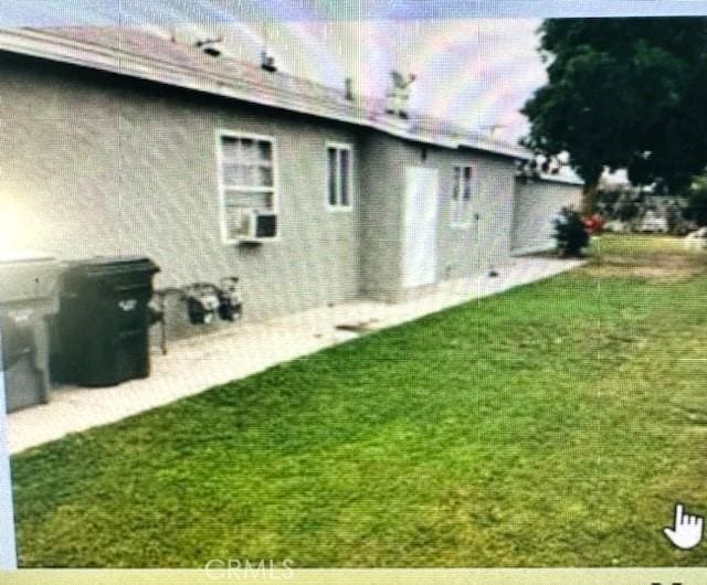 1243012434 Peach St A-B, Unit A-B Lynwood, CA 90262 - rear view of property featuring a lawn