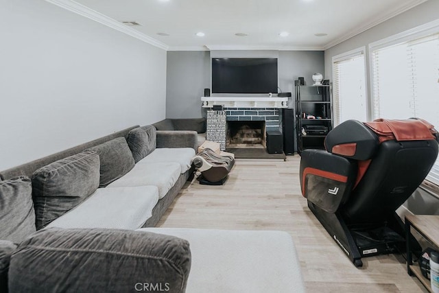 2438 Emerson Cir, Corona, CA 92882 - living area with wood finished floors, crown molding, recessed lighting, and a fireplace with raised hearth