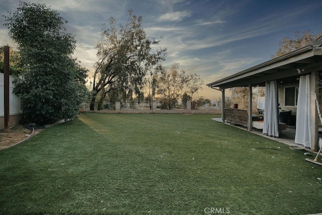 2438 Emerson Cir, Corona, CA 92882 - yard at dusk with a fenced backyard