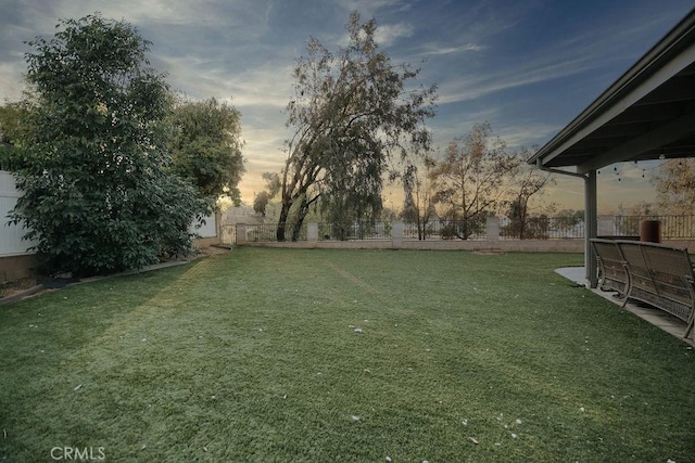 2438 Emerson Cir, Corona, CA 92882 - yard at dusk with a fenced backyard