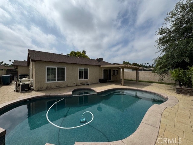 8641 Limestone Dr, Riverside, CA 92504 - view of pool featuring a patio and a pool with connected hot tub