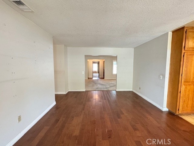 8641 Limestone Dr, Riverside, CA 92504 - empty room featuring hardwood / wood-style flooring and a textured ceiling