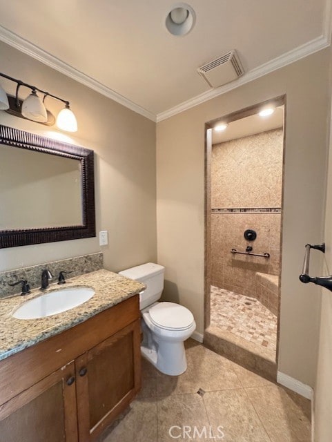 8641 Limestone Dr, Riverside, CA 92504 - bathroom featuring vanity, a tile shower, crown molding, and tile patterned floors