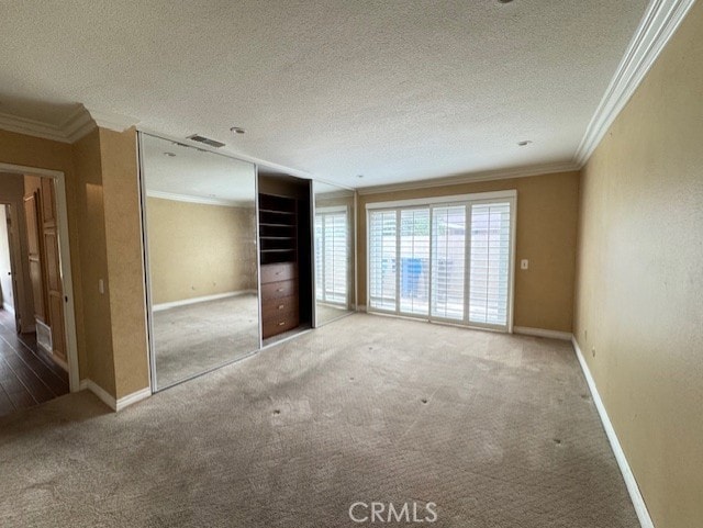 8641 Limestone Dr, Riverside, CA 92504 - unfurnished bedroom with carpet, ornamental molding, and a textured ceiling