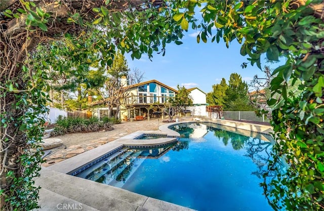 23216 Park Esperanza, Calabasas, CA 91302 - view of swimming pool featuring a fenced backyard, a wooden deck, a pool with connected hot tub, and a patio