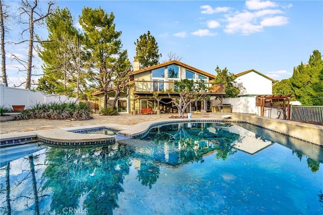 23216 Park Esperanza, Calabasas, CA 91302 - view of pool featuring a fenced backyard, a wooden deck, a pergola, and a pool with connected hot tub