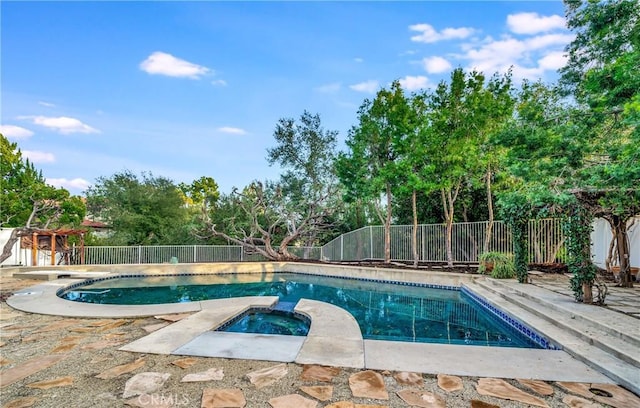 23216 Park Esperanza, Calabasas, CA 91302 - view of pool featuring a fenced backyard, a patio area, a pool with connected hot tub, and view of scattered trees