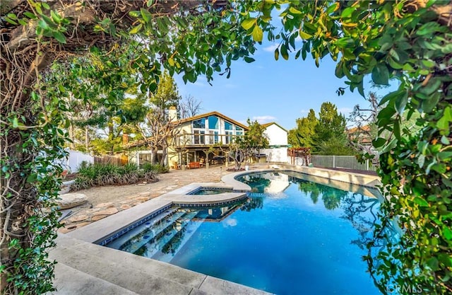 23216 Park Esperanza, Calabasas, CA 91302 - view of swimming pool featuring a fenced backyard, a deck, a pool with connected hot tub, and a patio