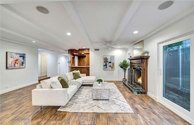 23216 Park Esperanza, Calabasas, CA 91302 - living area with wood finished floors, a warm lit fireplace, a ceiling fan, and recessed lighting