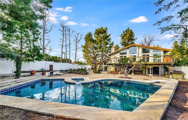 23216 Park Esperanza, Calabasas, CA 91302 - view of pool with a wooden deck, a fenced backyard, a patio, stairway, and a diving board