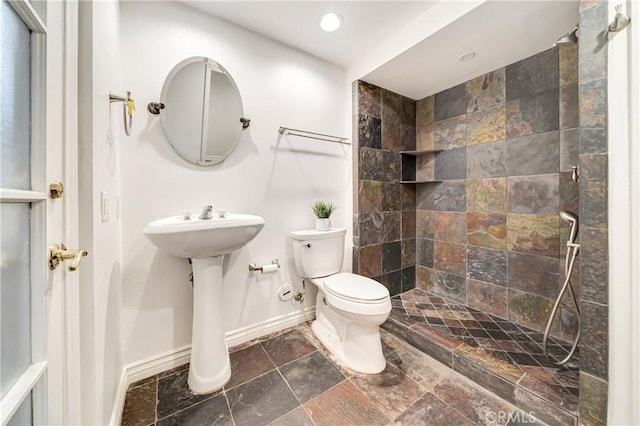 23216 Park Esperanza, Calabasas, CA 91302 - bathroom with a tile shower, stone tile floors, and recessed lighting