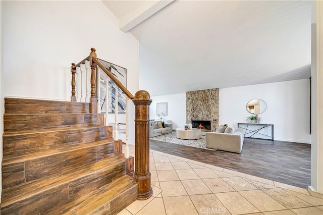 23216 Park Esperanza, Calabasas, CA 91302 - staircase with tile patterned floors and a large fireplace