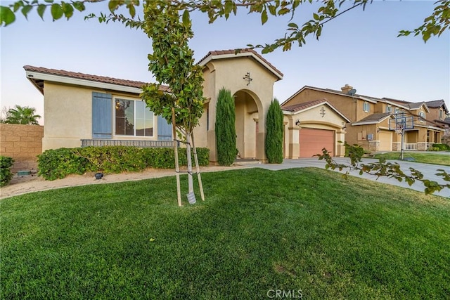 42432 72nd St W, Lancaster, CA 93536 - mediterranean / spanish-style house with stucco siding and a garage