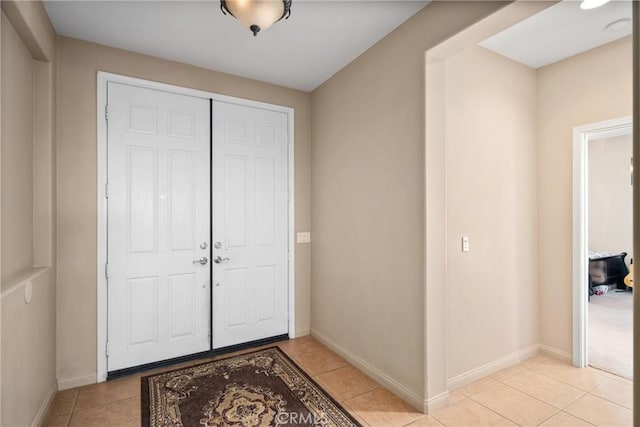 42432 72nd St W, Lancaster, CA 93536 - entrance foyer with light tile patterned floors and baseboards