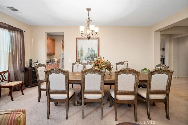 42432 72nd St W, Lancaster, CA 93536 - dining area featuring a chandelier and light colored carpet
