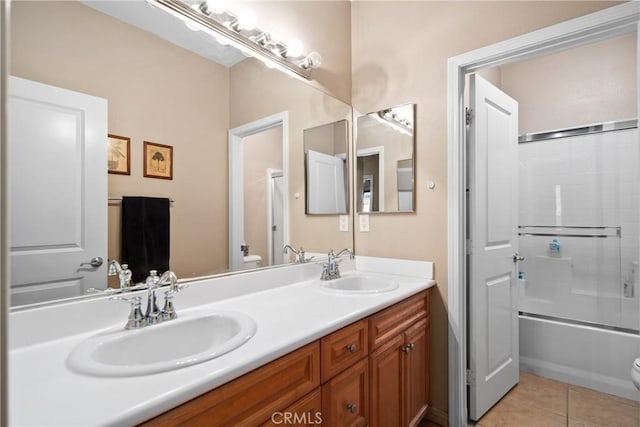 42432 72nd St W, Lancaster, CA 93536 - bathroom featuring double vanity, tile patterned floors, and shower / bath combination with glass door