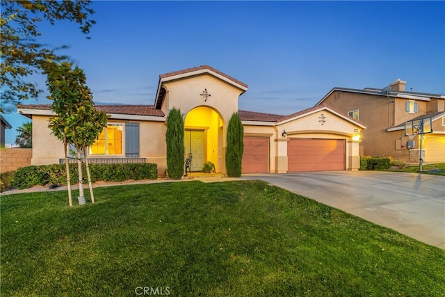42432 72nd St W, Lancaster, CA 93536 - mediterranean / spanish house with an attached garage, a tiled roof, stucco siding, and concrete driveway