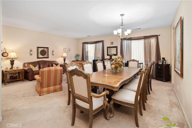 42432 72nd St W, Lancaster, CA 93536 - dining room with a chandelier, light colored carpet, and plenty of natural light