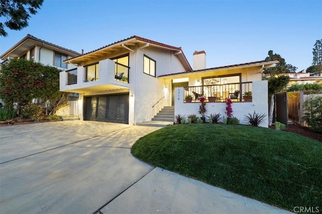 1716 Via Zurita, Palos Verdes Estates, CA 90274 - view of front of home with an attached garage, stucco siding, a chimney, and concrete driveway