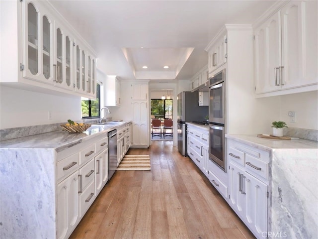 1716 Via Zurita, Palos Verdes Estates, CA 90274 - kitchen with stainless steel appliances, white cabinetry, light wood-style flooring, and recessed lighting