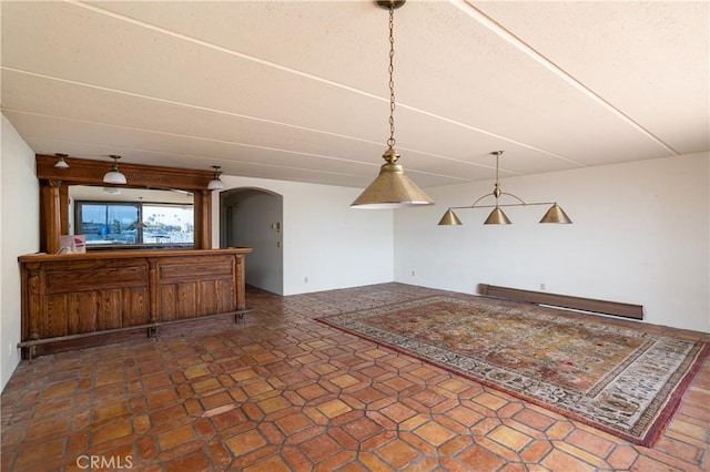 809 Via Lido Soud, Newport Beach, CA 92663 - unfurnished living room with arched walkways and a baseboard radiator