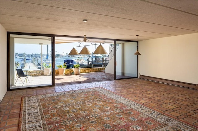 809 Via Lido Soud, Newport Beach, CA 92663 - unfurnished dining area with a wall of windows and baseboard heating